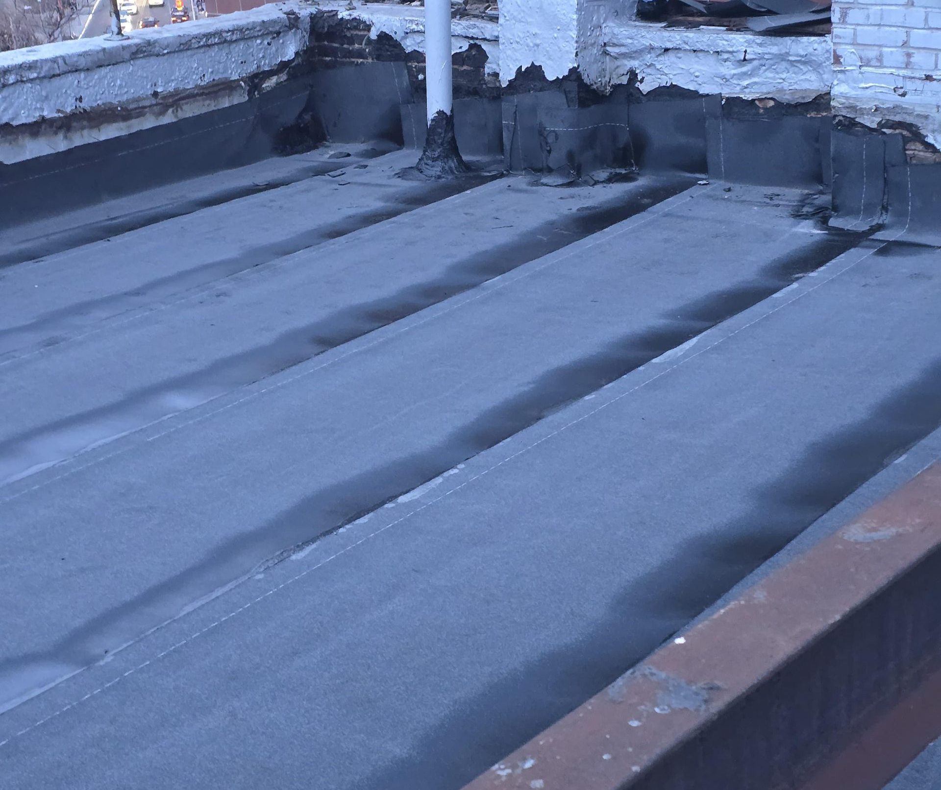 Flat Roof Replacement Project in Downtown Manhattan NYC with new roofing