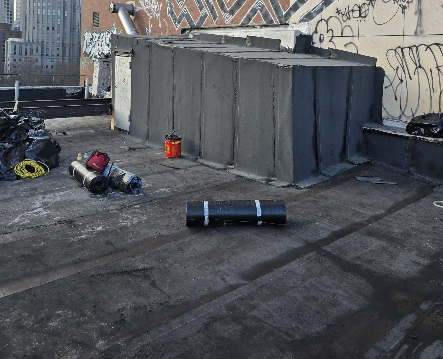 Flat Roof Replacement Project in Downtown Manhattan NYC with new roofing system installation