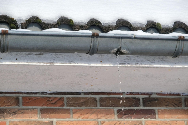 Roof leak after snow caused by melting snow and ice on a New York home