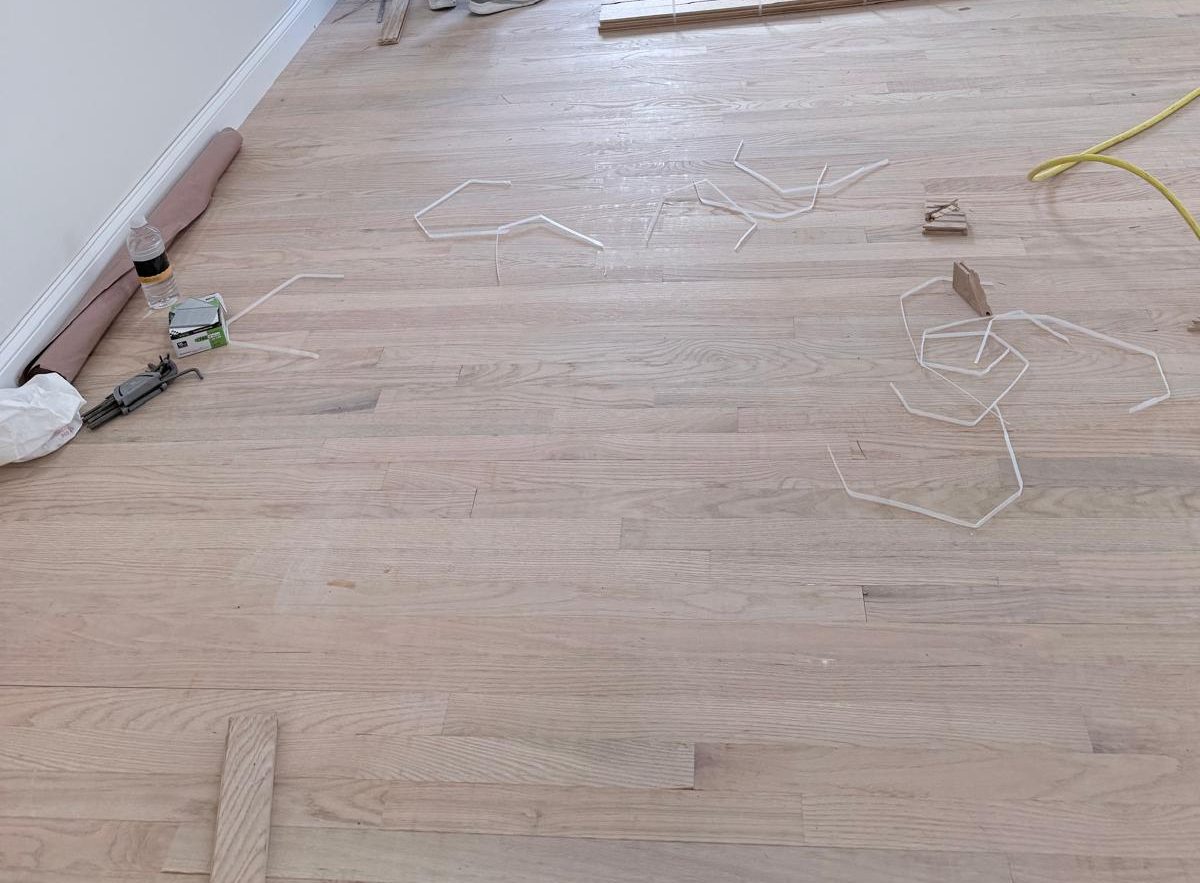 Hardwood floor installation project in progress by liberty general contracting inc